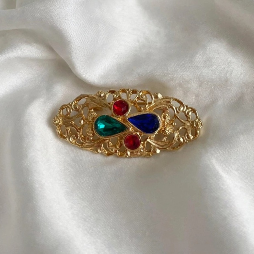 “VTG” Style Gold Brooch with Red, Green, and Blue Stones